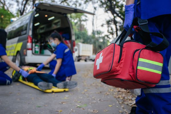 Ambulance emergency service firs aid accident on road.